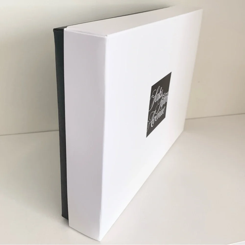 Hold Saks Fifth Avenue gift boxes